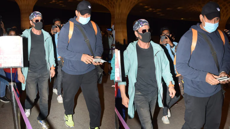 Shah Rukh Khan greets Mumbai airport security with folded hands as he flies out days after Pathaan teaser launch. Watch